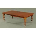 A Victorian mahogany pull out extending dining table,