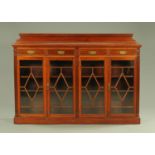 An Edwardian walnut low bookcase,