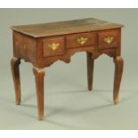 A George III oak lowboy,