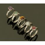 Five silver assayed dress rings, each set with semiprecious polished stones, sizes L-M.