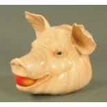 A large Goebel pottery pigs head, 20th century, modelled with an apple its mouth, printed marks,