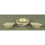 A pair of famille verte lozenge shape pedestal dishes, late 19th century,