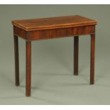 A George III mahogany turnover top games table, with moulded edge,