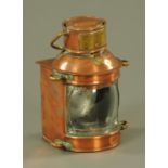 A ships lantern, with brass carrying handle and applied brass plate inscribed "Overtaking Patt.