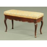 An Edwardian duet stool, of rectangular form, with upholstered top and hinged lid,