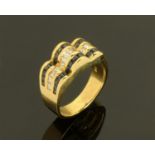 A Continental 18 ct gold channel set sapphire and diamond ring, with square and baguette cut stones,