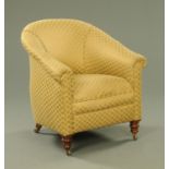 A Victorian tub chair, with sprung seat and gold lozenge upholstered material,