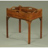 A mahogany George III style fixed tray top type table,