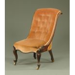 An early Victorian rosewood framed button back chair,
