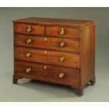 An early 19th century mahogany chest of drawers,