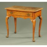 A George III mahogany lowboy, with rounded corners and single frieze drawer,