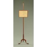 A 19th century mahogany pole screen,
