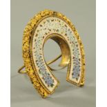 A micro mosaic pocket watch stand, of horseshoe shape with easel back, early 20th century.