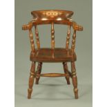 A stained beech and elm captains style child's chair,