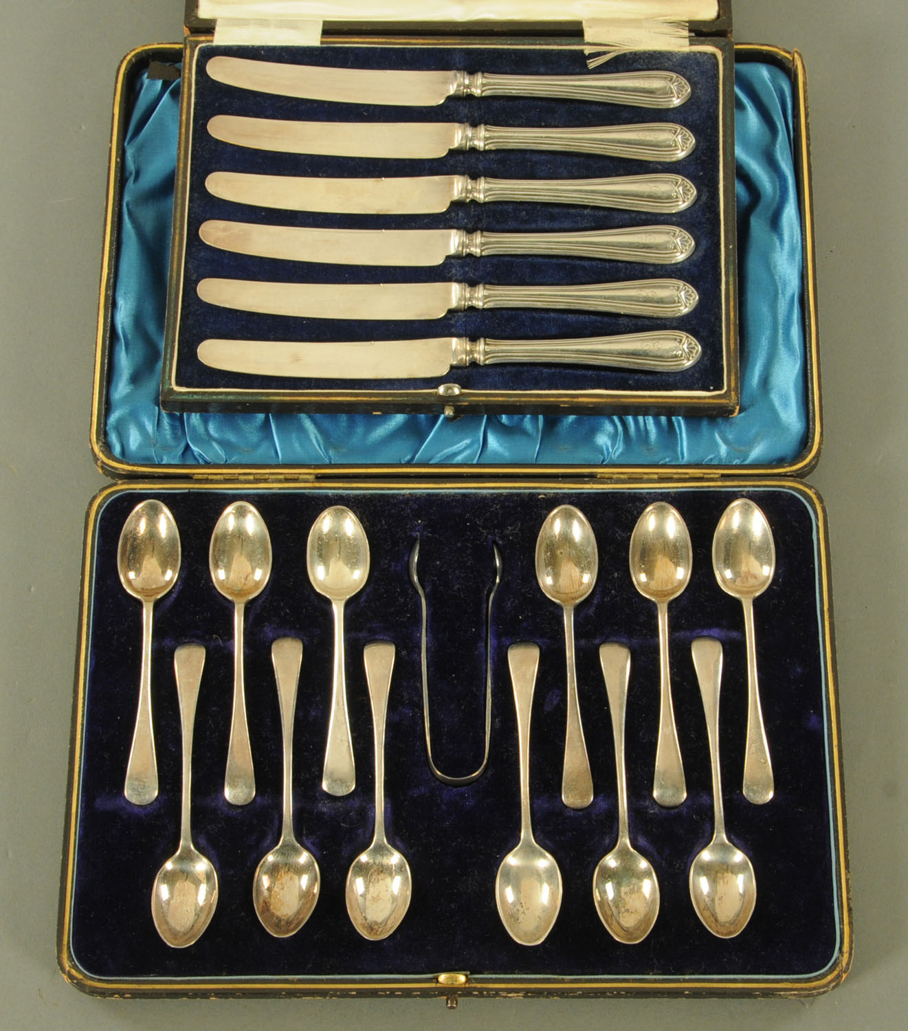 A case of 12 silver coffee spoons and tongs, maker Joseph Rodgers & Son,