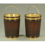 A pair of George III style mahogany peat buckets, with brass bale part twist handle and brass liner,
