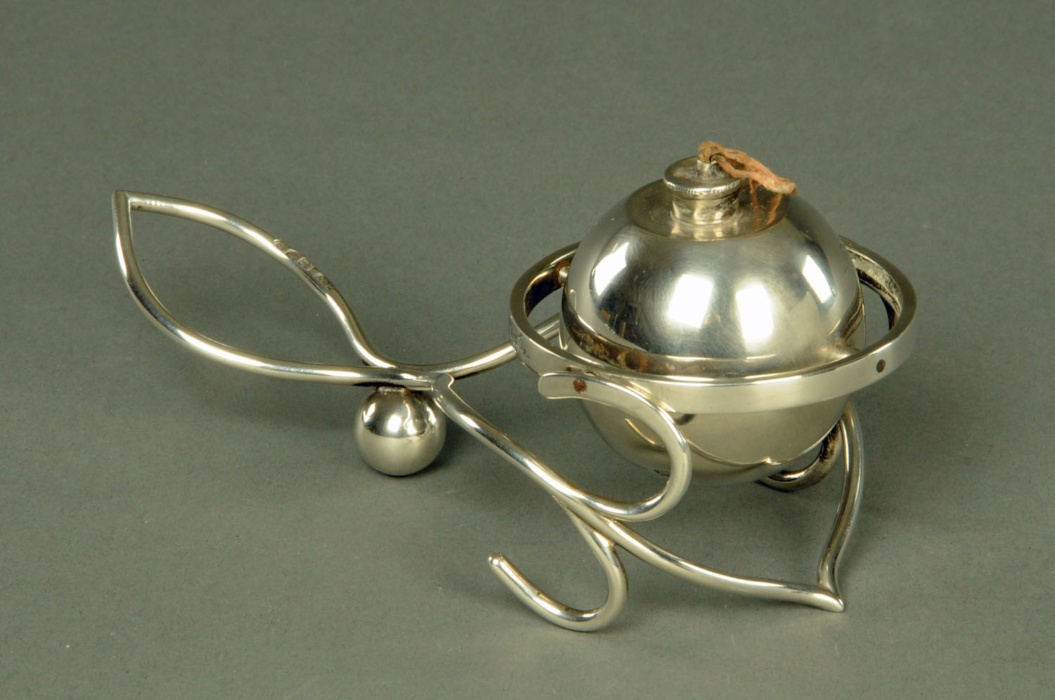 A silver gimbal table lighter, Joseph Braham, London 1913,