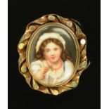 A Victorian porcelain memoriam brooch, in Pinchbeck mount, the back with plaited hair panel,