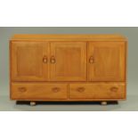 An Ercol light elm sideboard, circa 1960/70's, of rectangular form,