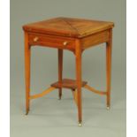 An Edwardian mahogany and boxwood strung envelope card table,