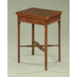 An Edwardian mahogany turnover top table, fitted with a single end drawer and opposing dummy drawer,