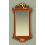 A George III style fretwork wall mirror, with ho-ho bird mount. Width 50 cm.