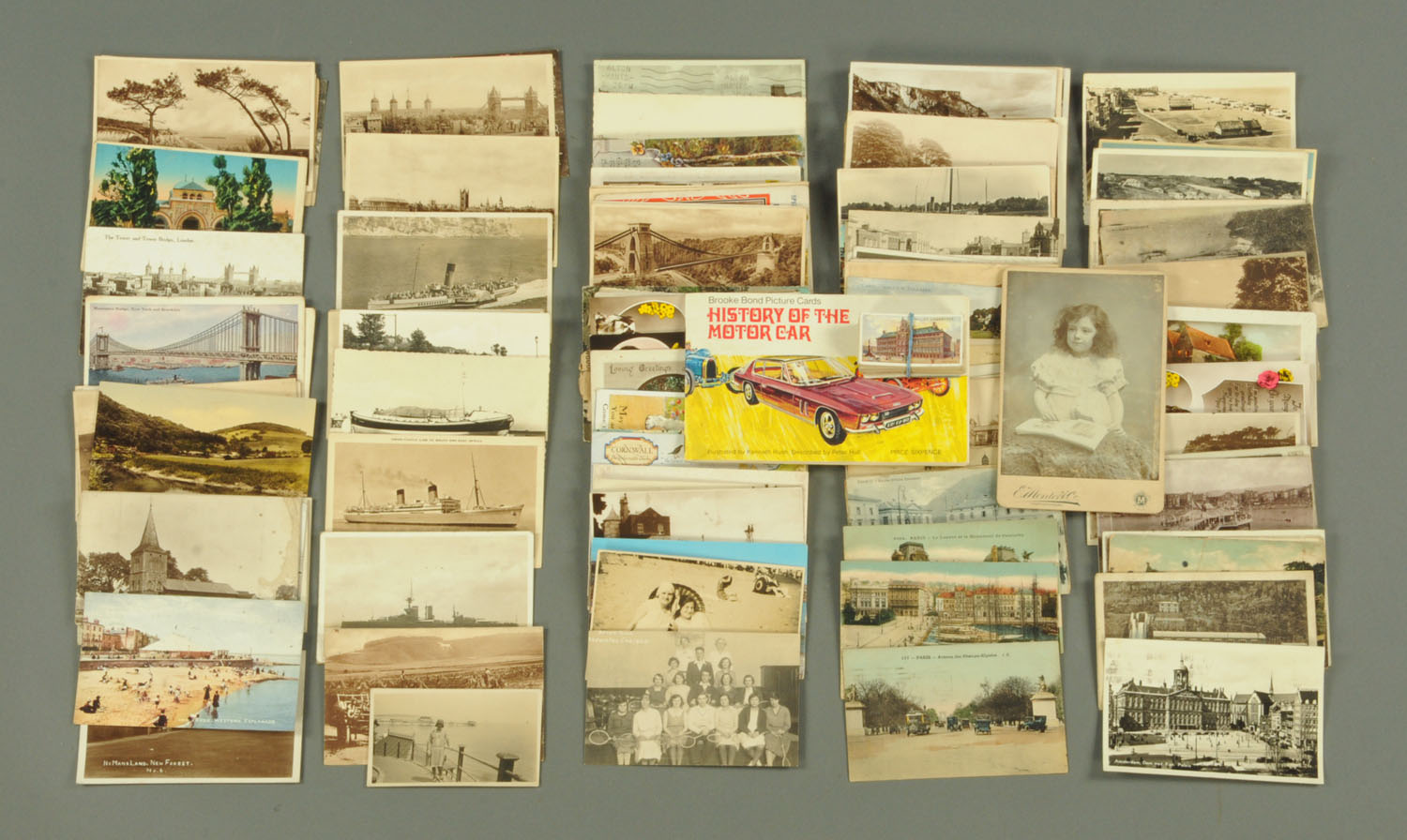 A quantity of vintage postcards and cigarette cards, to include Brooke Bond picture card,