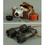 A pair of Ross Steplux 7 x 50 binoculars, mid 20th century, and a Super Paxette 35 mm camera.