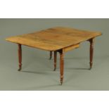 A Regency mahogany concertina action extending dining table, with two leaves,
