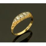 An 18 ct gold ring set with five diamonds, size M. CONDITION REPORT: 2.1 grams.