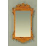 A George III style walnut veneered fretwork wall mirror, early 20th century,