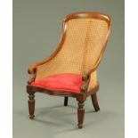 A Regency mahogany bergere armchair, with moulded frame,