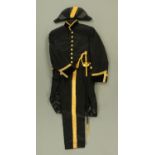 An Elizabeth II diplomats dress suit, comprising peaked cap, bicorn hat, dress sword and cover,