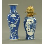 Two Chinese blue and white prunus pattern vases, late 19th century, one of typical baluster form,