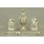 A pair of silver condiments, salt and pepper, Birmingham 1923 and 1924, a silver pepperette,