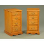 A pair of walnut bedside chests of drawers,