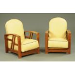 A pair of Art Deco oak armchairs, the cushions upholstered in cream leather with brown piping.