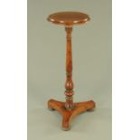 A William IV candle stand, with circular top, turned column and triform base raised on short feet.