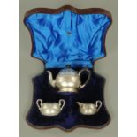 An Indian inspired three piece silver tea set, Horace Woodward & Co, London 1878,