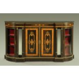 A Victorian ebonised credenza with amboyna and inlaid decoration,