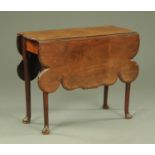 A mid 18th century mahogany drop leaf table,