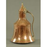 A Turkish copper and brass bell shaped ewer, with a brass finial and handle. Height 51 cm.