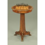 A Victorian rosewood games table,