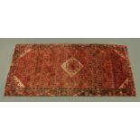 A Kashgai rug, hand knotted. 297 cm x 142 cm.