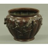 A Japanese patinated bronze melon form jardiniere, Meiji period,