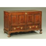 A George III oak mule chest, with four panelled front,