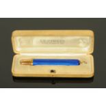 A Russian gold and Guilloche enamel pencil, makers initials "AA" for Andre Adler,