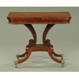 A Regency mahogany turnover top card table, with carved beaded edge, with baize interior surface,