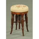 A Regency mahogany revolving piano stool,