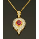 An 18 ct yellow gold ruby and diamond set pendant on chain, ruby +/- .25 carats, diamonds +/- .